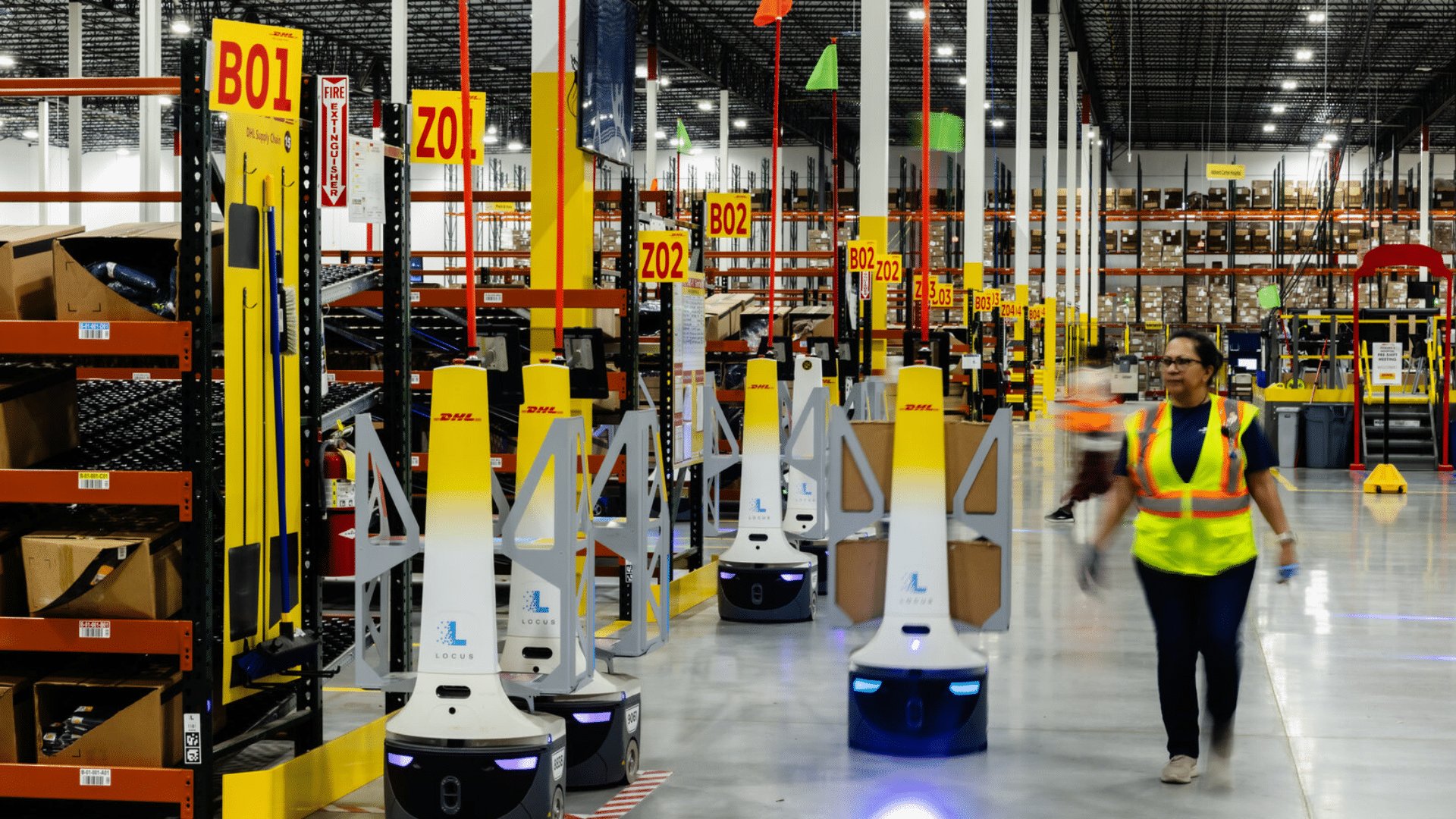 a warehouse with automated robots and workers enhancing efficiency in inventory and order fulfillment