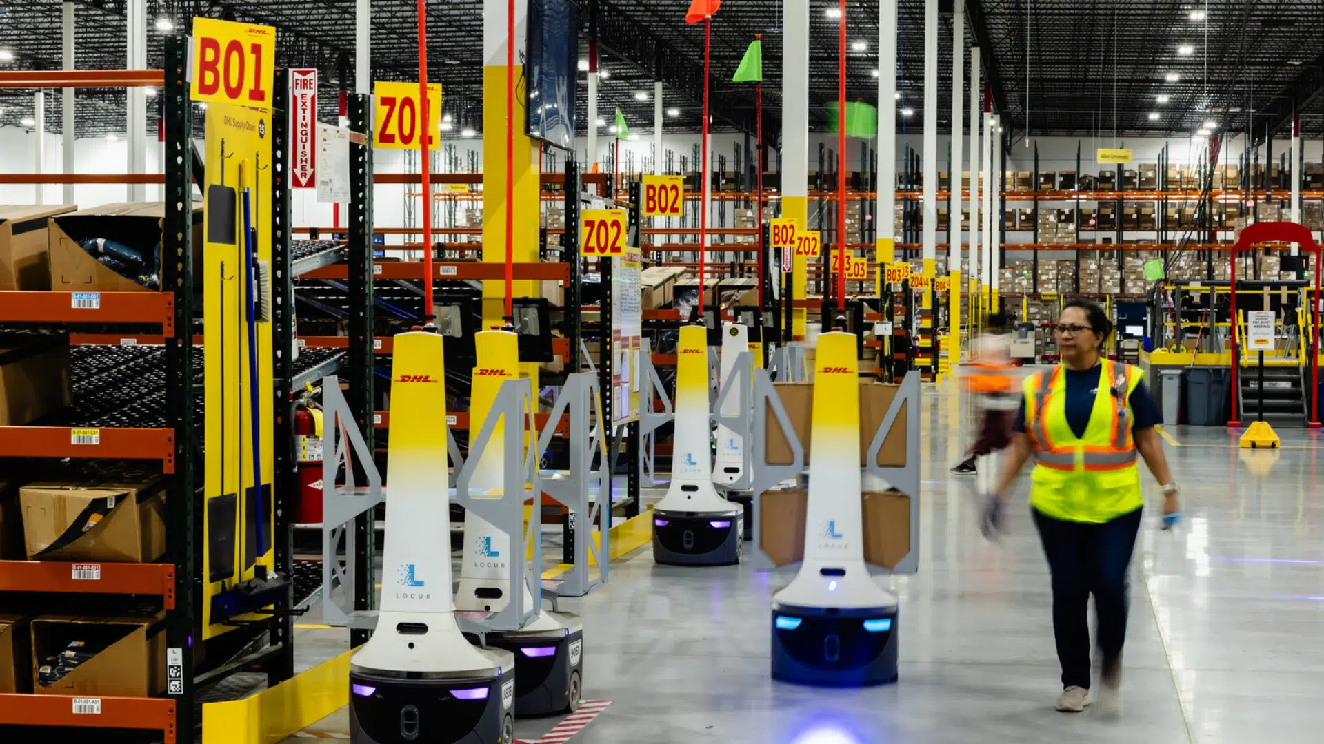a warehouse with automated robots and workers enhancing efficiency in inventory and order fulfillment