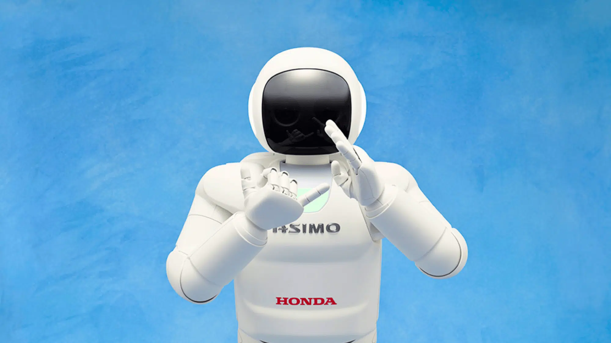 honda humanoid asimo robot performing a gesture
