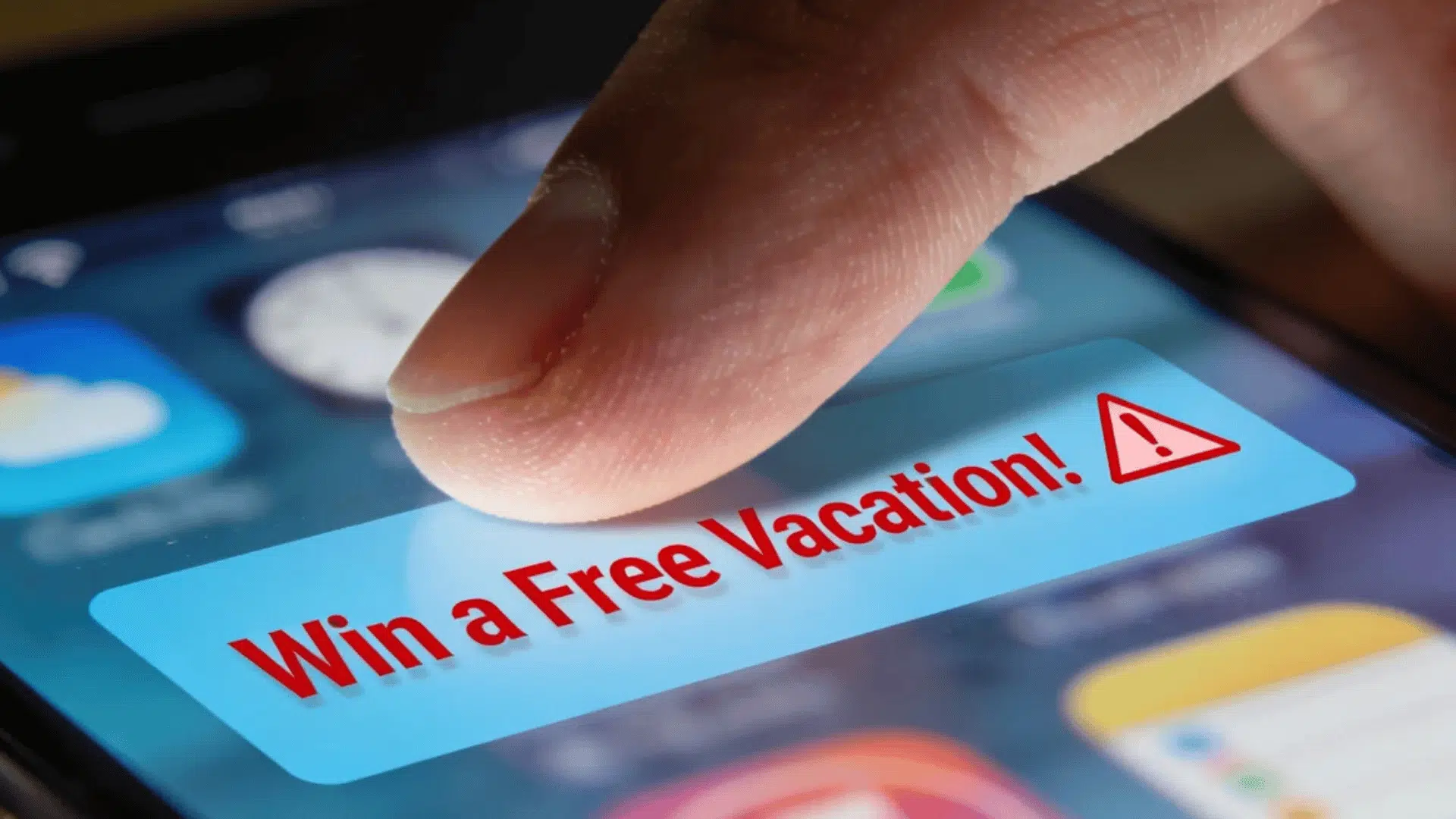 a finger tapping a smartphone screen displaying a win a free vacation scam popup with warning symbol on screen