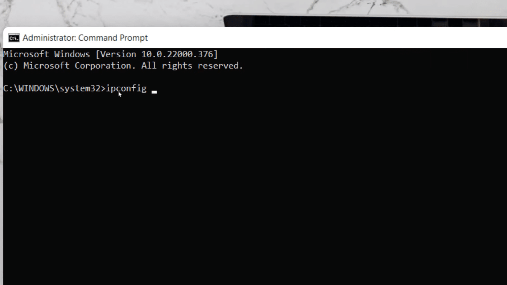 administrator command prompt window displaying ipconfig command typed in system32 directory on windows desktop screen