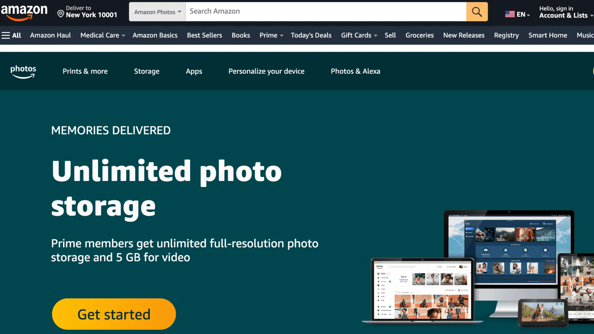 amazon photos webpage featuring a laptop desktop computer and mobile devices displaying digital photo galleries (1)
