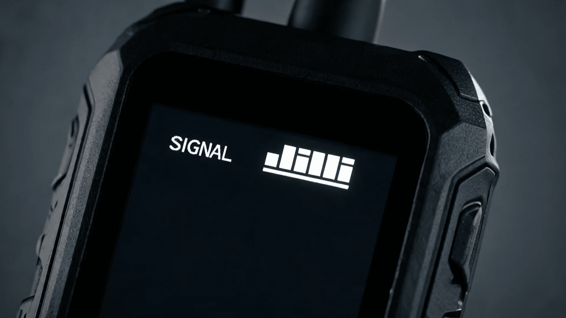 holding a satellite phone device outdoors for emergency communication in a forest area (1)