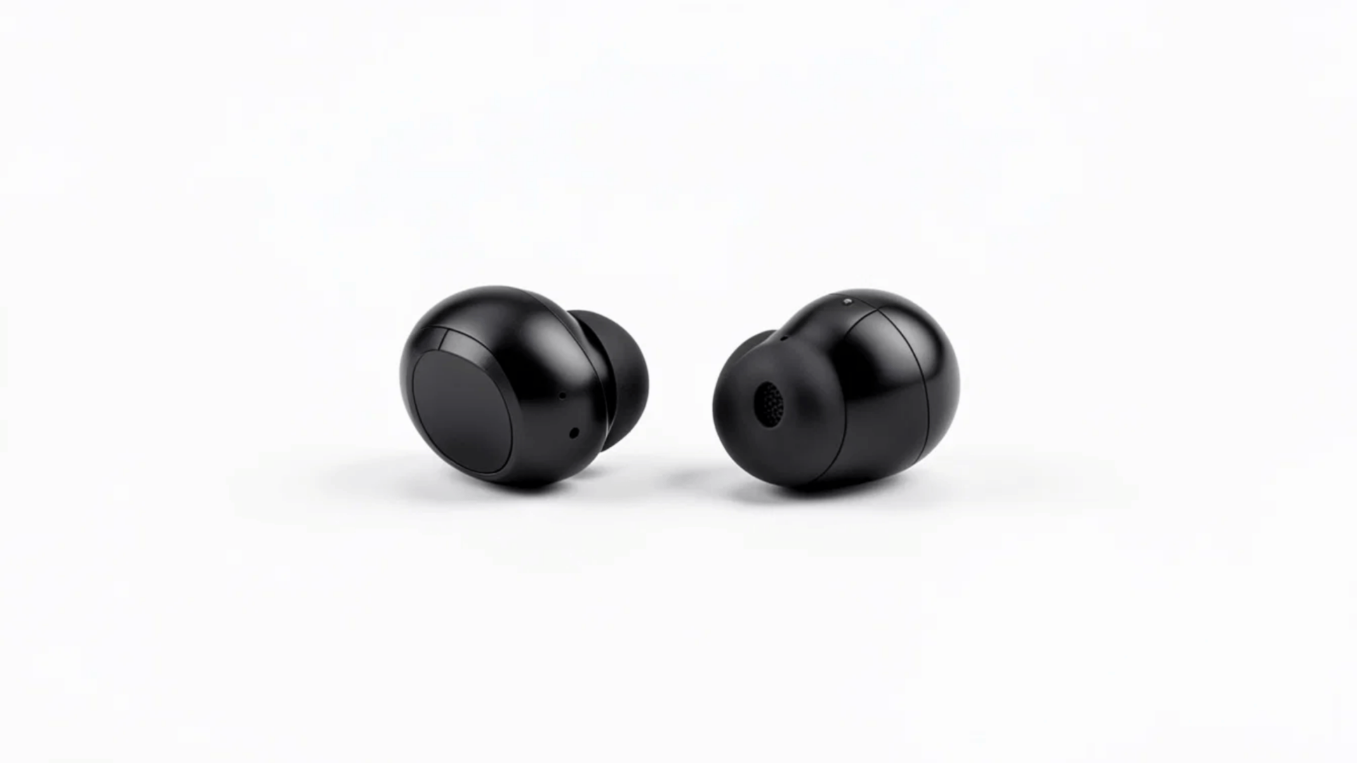 pair of black wireless earbuds displayed on a white background with rounded design and silicone ear tips