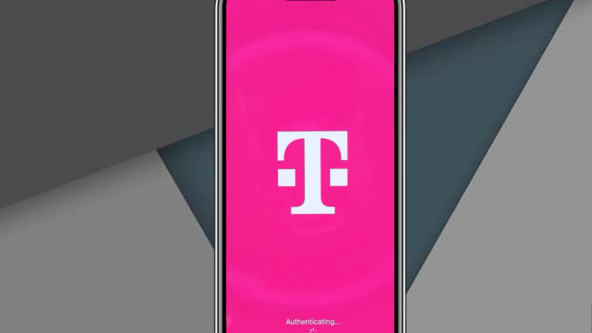 smartphone displaying t mobile logo on pink authentication screen with geometric gray background and loading icon