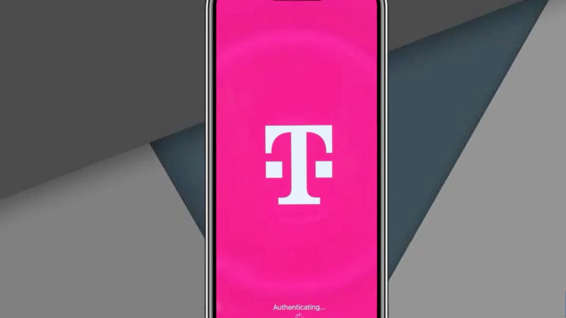 smartphone displaying t mobile logo on pink authentication screen with geometric gray background and loading icon