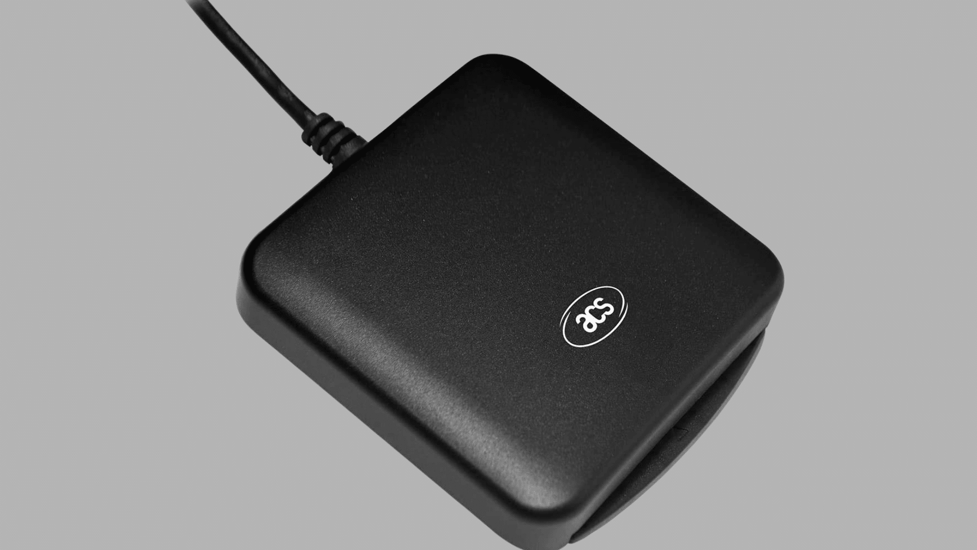 black smart card reader with attached usb cable designed for secure authentication and reading chip enabled cards