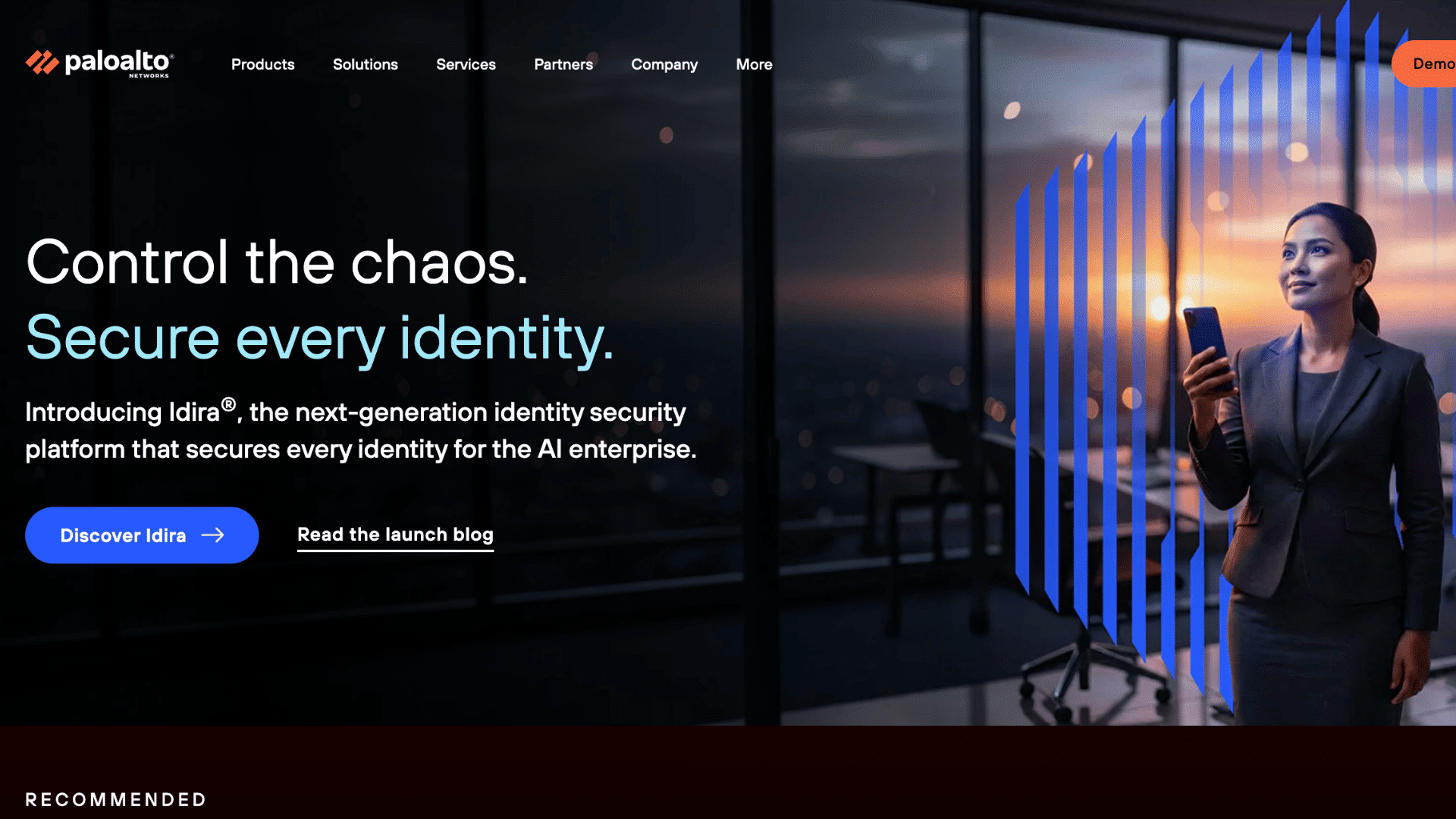 palo alto networks homepage promoting identity security with business professional holding phone in modern office setting