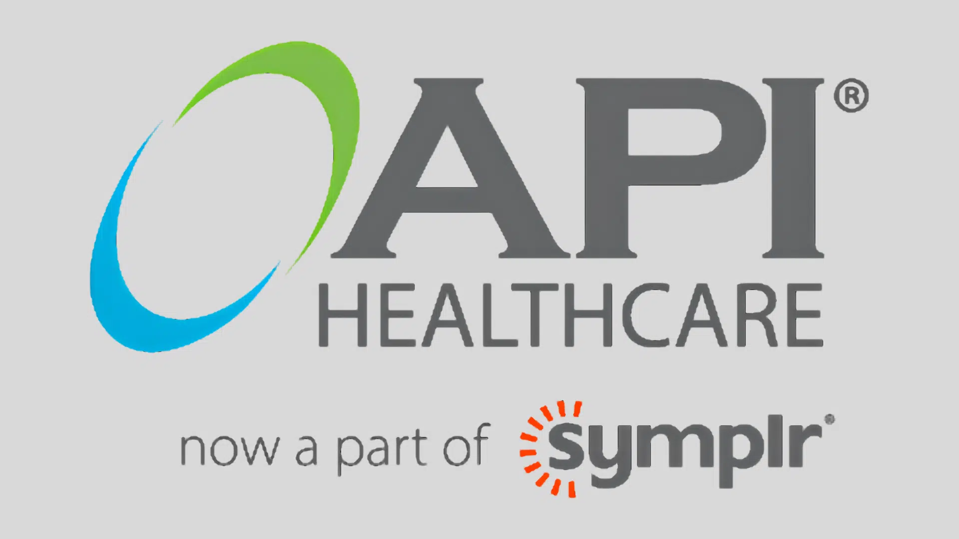 api healthcare logo with blue and green swoosh above text noting the company is now a part of symplr