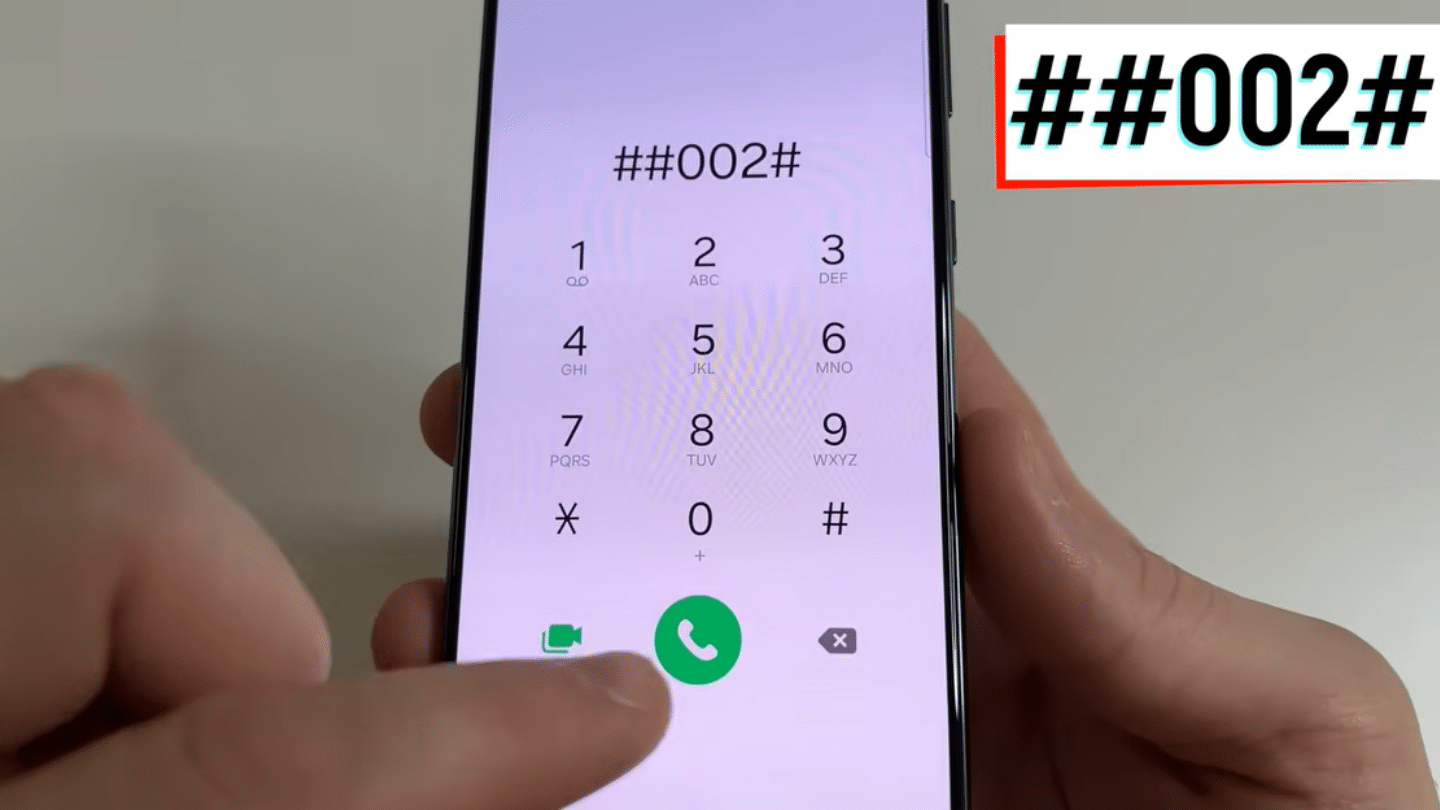 hand dialing code on smartphone keypad screen showing double hash zero zero two hash with finger pressing call button
