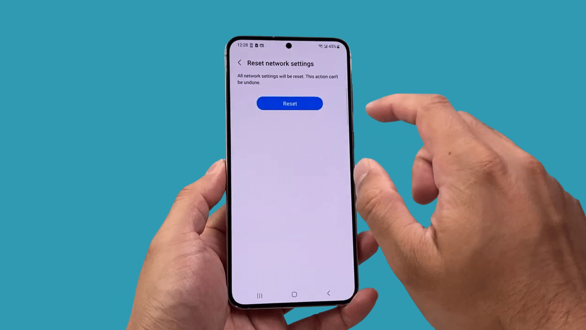 samsung phone showing network reset confirmation screen with reset button before restoring default connections