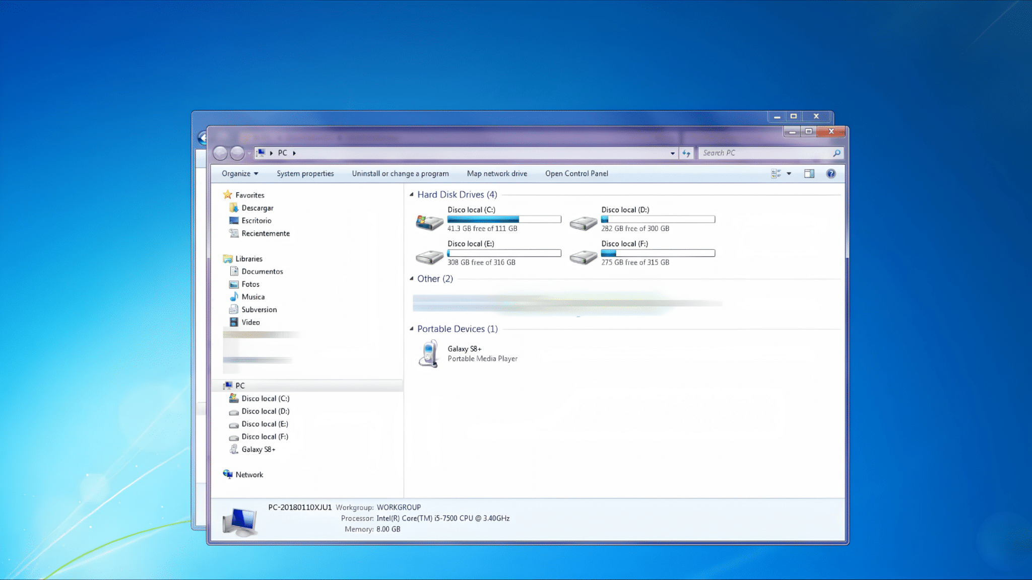 windows explorer displaying local disk drives and a connected galaxy smartphone listed as a portable device for file access and transfer on a computer system