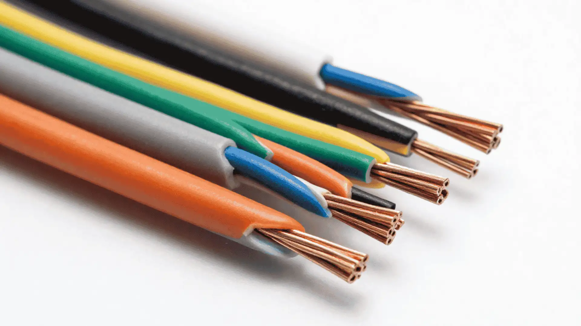 colorful insulated electrical wires with exposed copper strands arranged on a white background