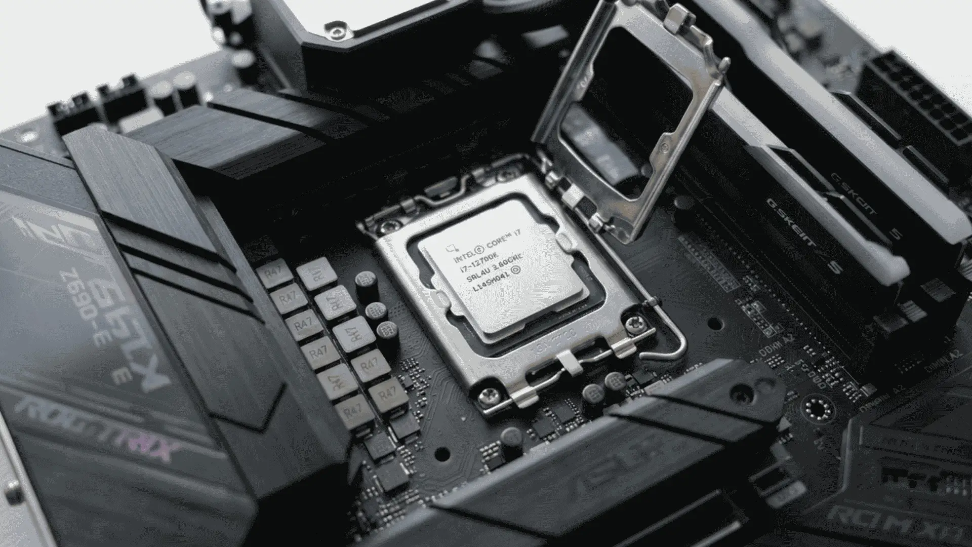 photo of a cpu being installed into a motherboard socket showing pins and mounting bracket