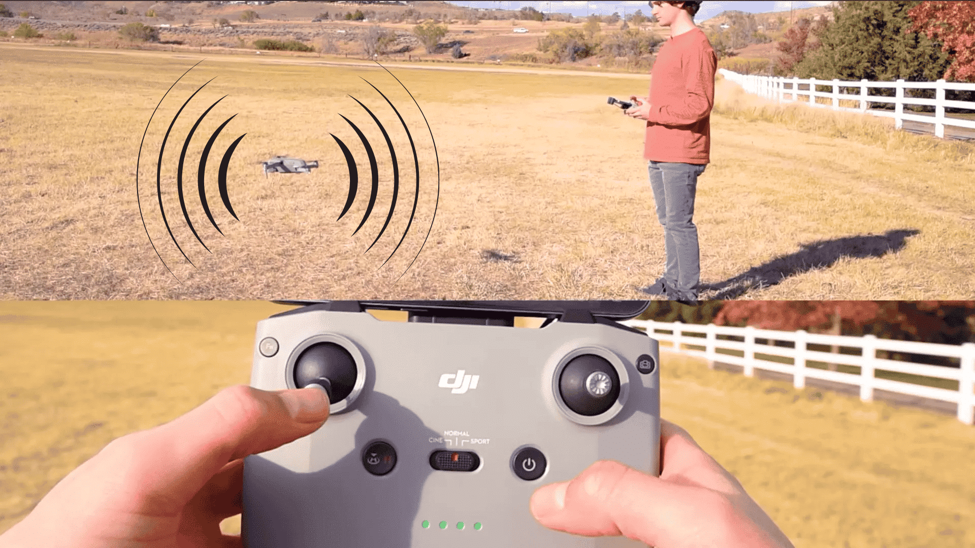 man watching a low hovering drone while holding the controller in an open grassy field
