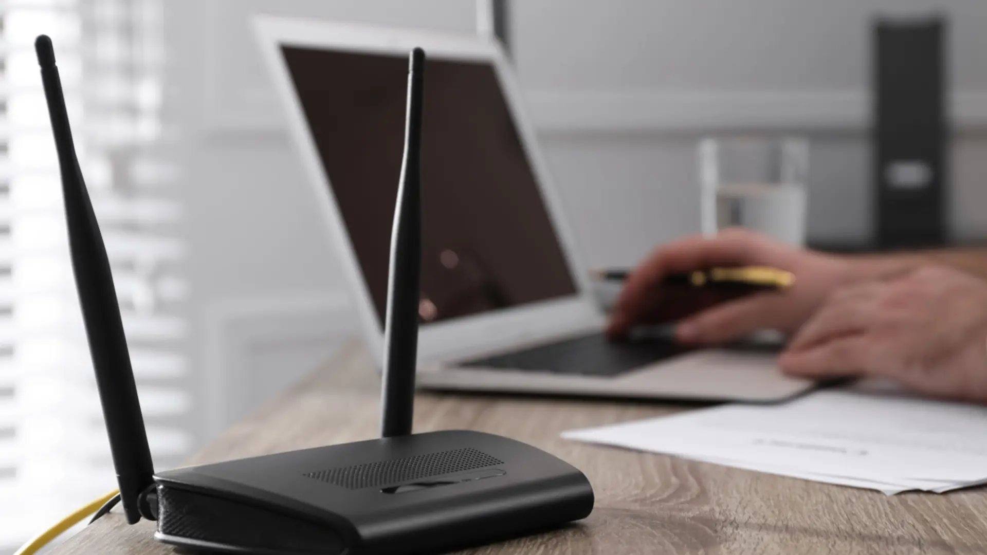 router firmware update screen beside device while status lights remain steadily powered on