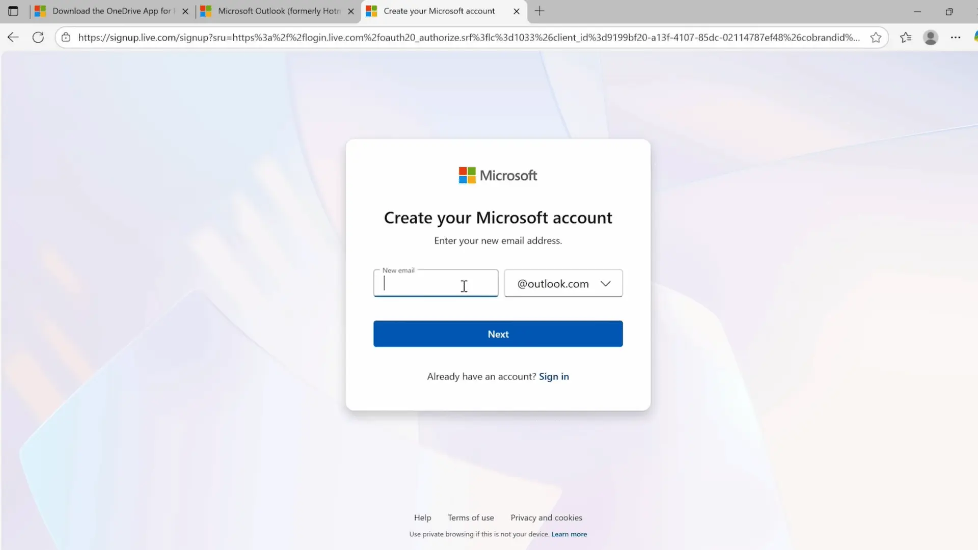 user signing in to onedrive with a microsoft account on a laptop before accessing cloud files